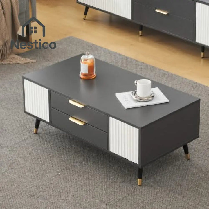 Modern gray and white coffee table with drawers and gold accents