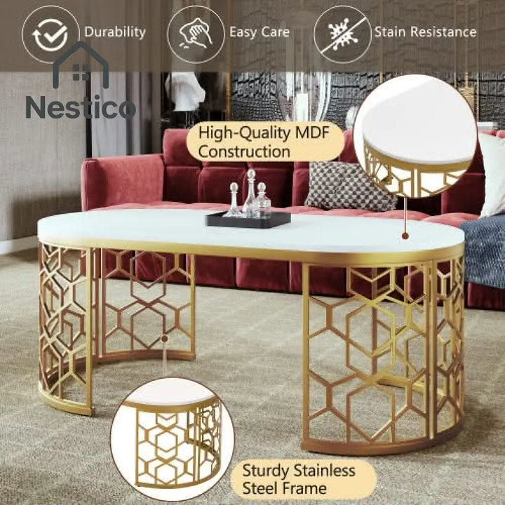 White oval coffee table with gold stainless steel base and cut-out pattern